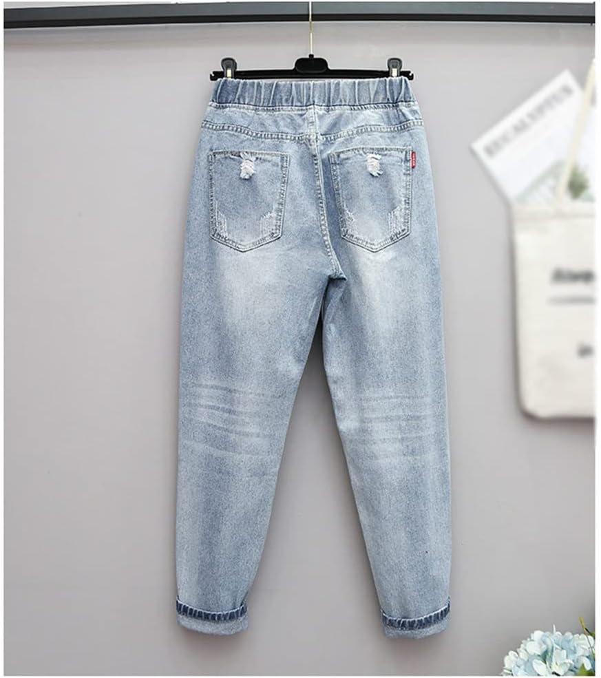 Ripped high-waisted oversized jeans for women. Plus-size distressed denim, a trendy & comfortable casual pant style.
