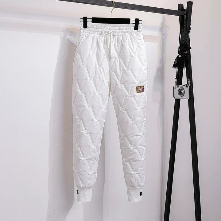 Soft fleece lining of women's thermal winter pants, ensuring warmth & comfort in cold weather.
