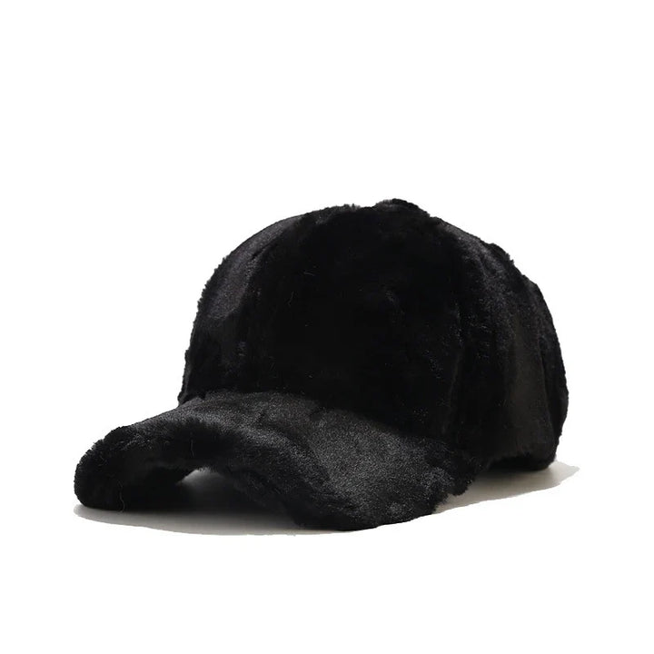 Stylish women's faux fur cap, cozy plush accessory for cold winter fashion.