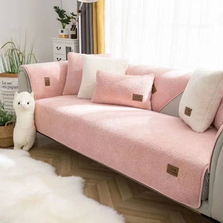Ultimate protection plush couch cover. Warm, soft, and non-slip polyester sofa protector for a cozy living room.