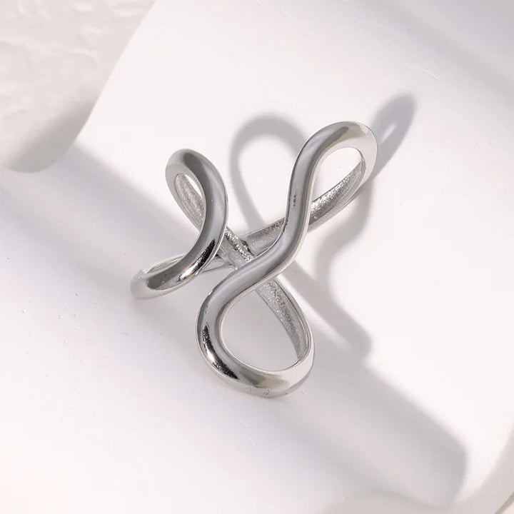 Women's gold wrap infinity ring, adjustable and tarnish-free. Water-resistant, hypoallergenic, and polished for shine.