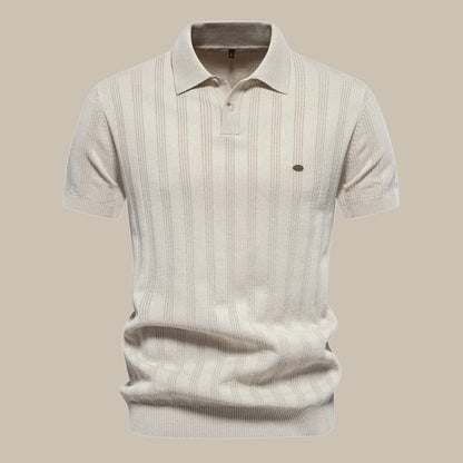 "Polo uomo in lana merino elegante, colore grigio, maniche corte, ideale per look casual e formali, morbida e confortevole."