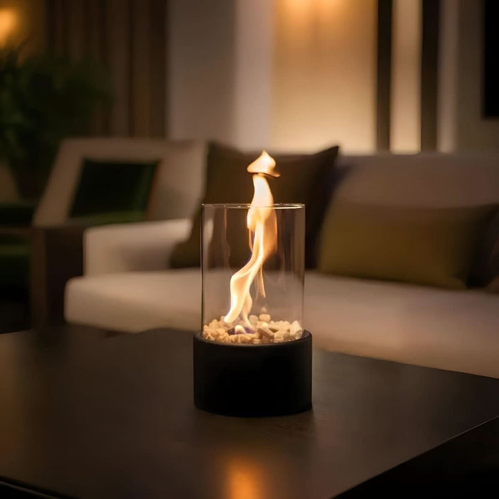 Modern black tabletop fireplace with real flame, ideal for living room or patio decor.