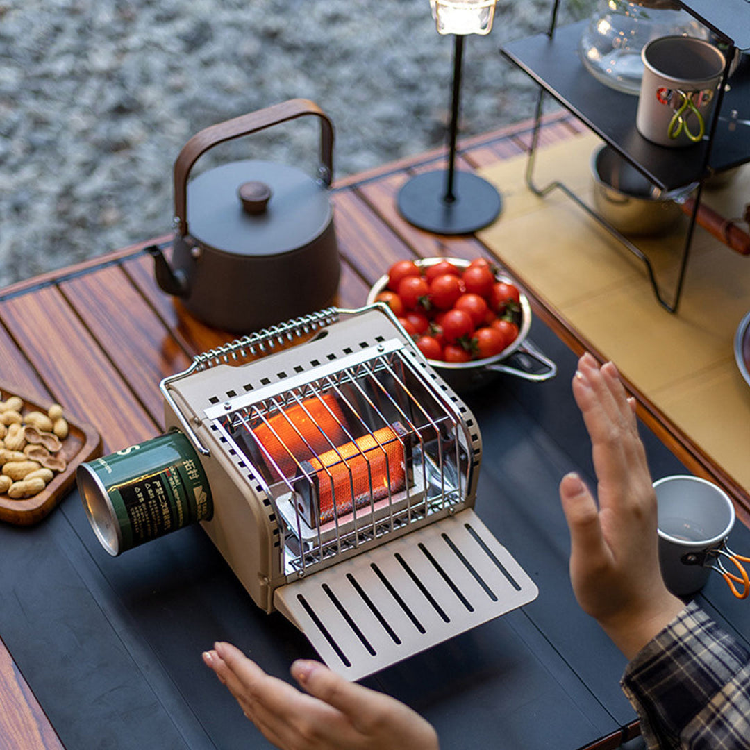 Compact butane heater for camping, providing essential warmth for survival in cold weather