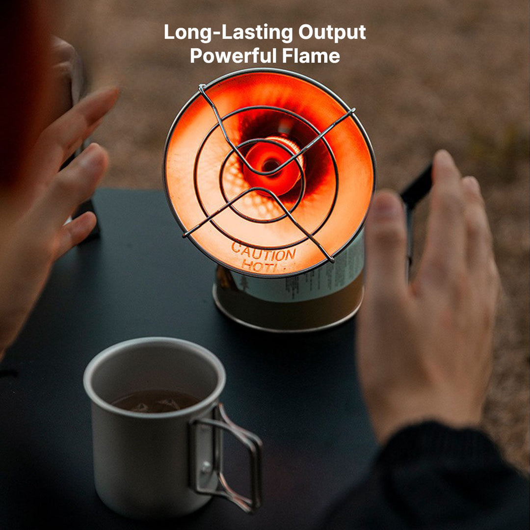 Compact portable butane heater, essential winter gear for camping, ensuring warmth in outdoor environments.