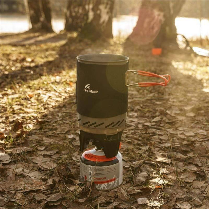 Detailed view of camping stove's heat exchanger fins on pot for fast & efficient outdoor cooking