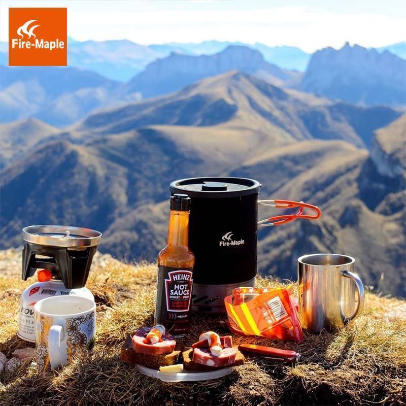 Camp kitchen setup with portable stove, pot, and flame, perfect for outdoor cooking & camping gear