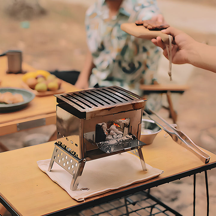 Close-up of the grill on a lightweight portable wood stove, perfect for outdoor picnic cooking.