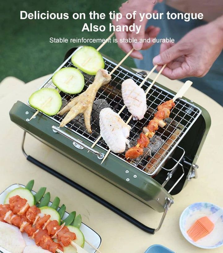Portable charcoal barbecue grill in use, smoke rising, perfect for outdoor grilling fun