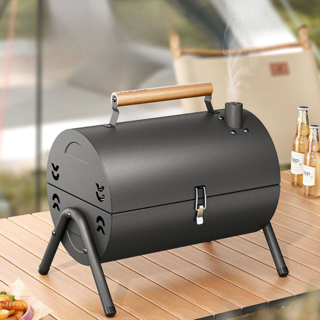 Small portable charcoal grill, excellent for outdoor cooking, camping, and picnics.