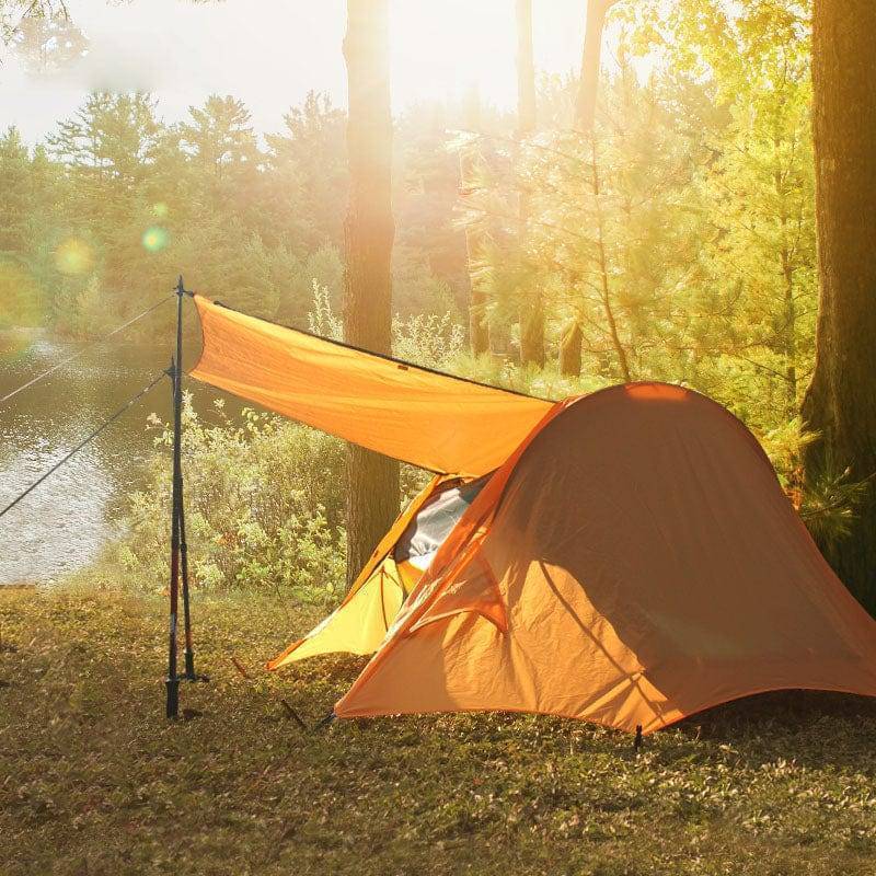 Portable elevated camping tent cot in camo, perfect for outdoor sleeping and shelter.