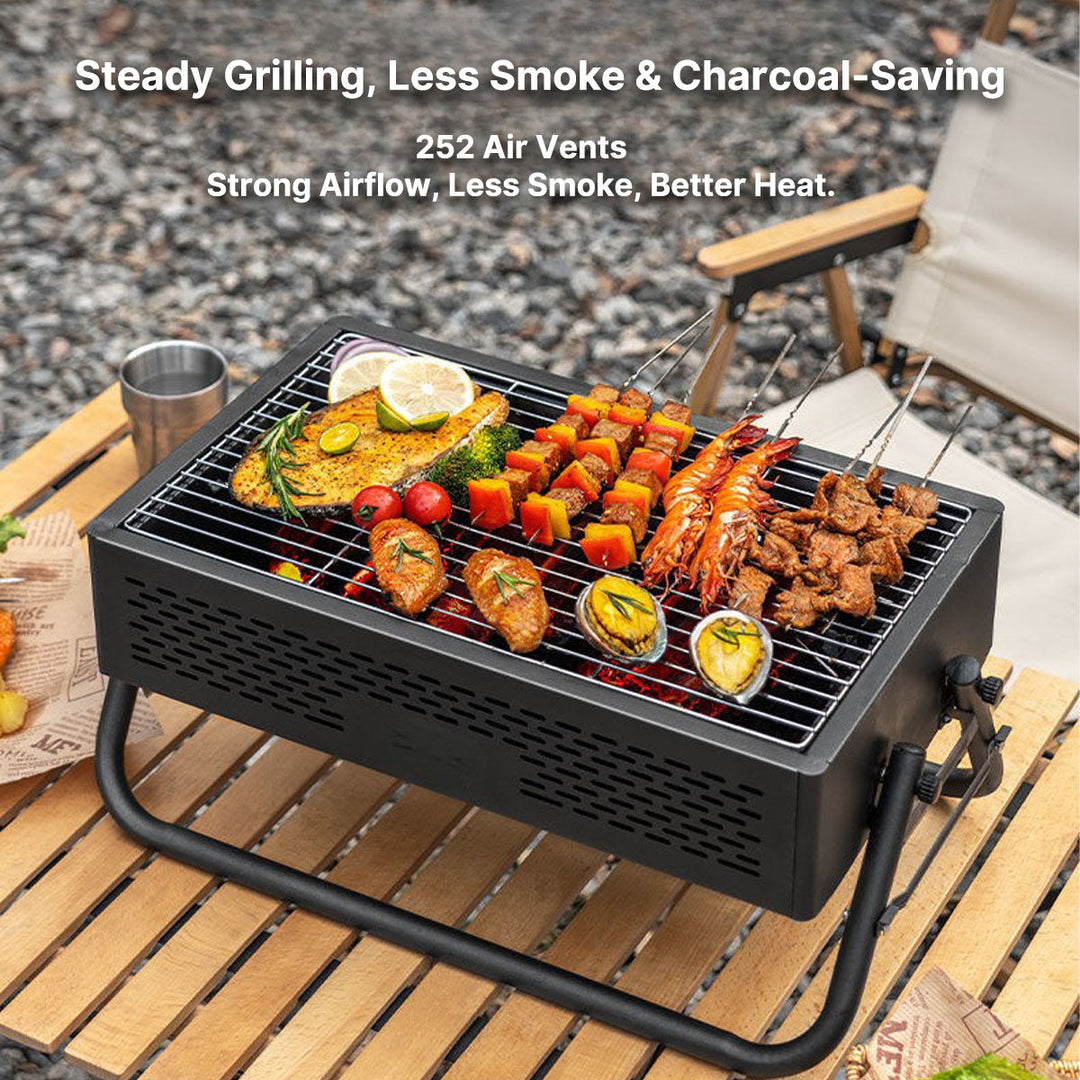 Folding camping BBQ grill with accessories, perfect for picnics