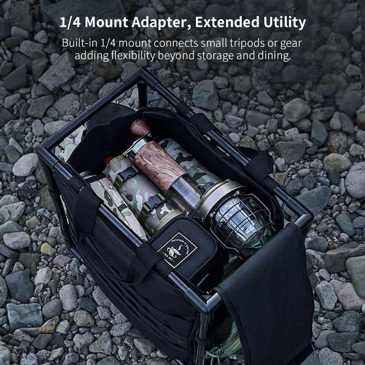 Hand carrying the folded aluminum camping table with its 30L storage bag, highlighting portability