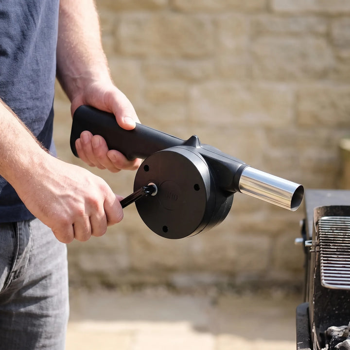 Portable hand crank BBQ fan for outdoor grilling & picnics. Manual campfire blower for easy charcoal ignition.