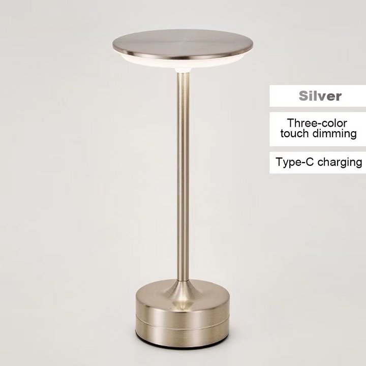 Gold rechargeable LED lamp, touch activated, ideal as a portable desk light.