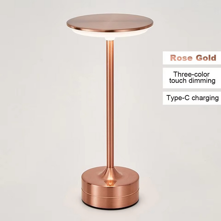 Rose gold LED bedside touch lamp, USB rechargeable, modern and portable.