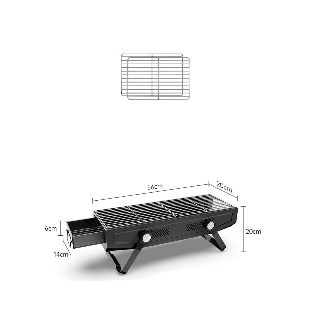 Stainless steel portable BBQ grill, ready for use at a campsite