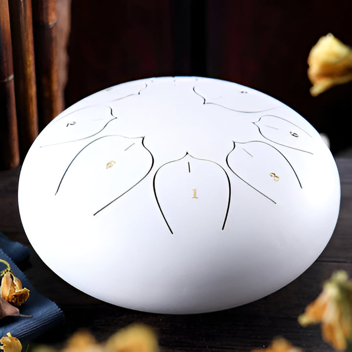 Meditative steel tongue drum, ideal for relaxation, stress relief, and creating calming music. Portable design.
