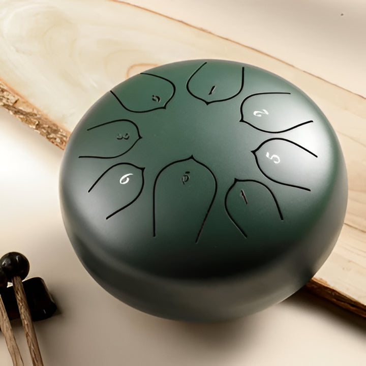 Elegant steel tongue drum for music education, yoga, & sound therapy. Easy to play, promotes tranquility.
