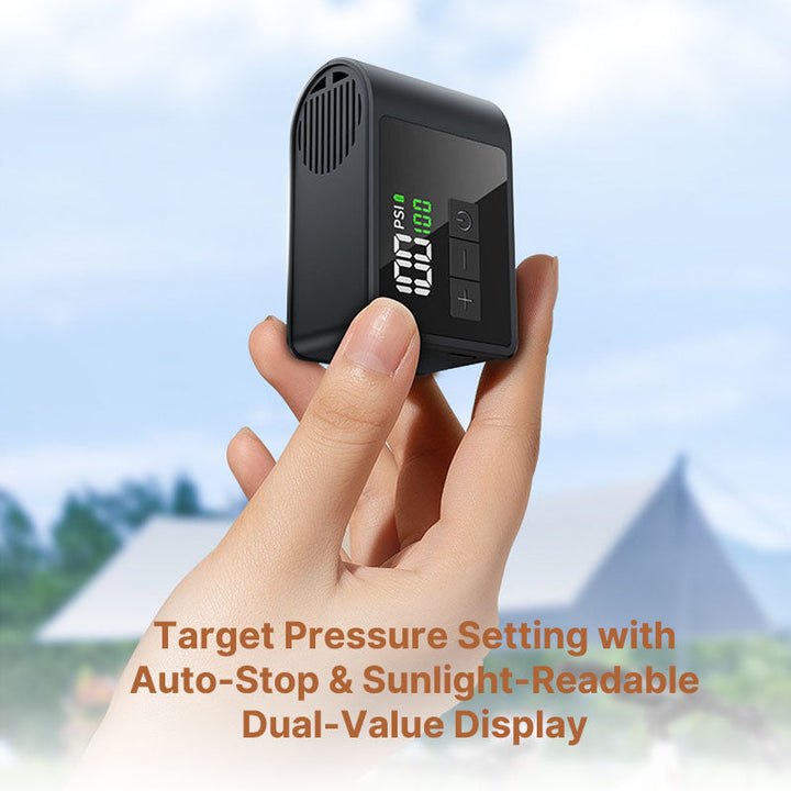 Compact Rapid-Inflate USB-C bike pump, black finish, shown with tire valve for easy use