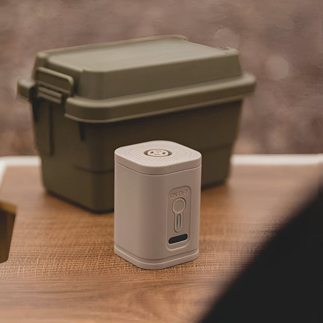 Portable USB rechargeable air pump with built-in camping light, perfect for outdoor mattress inflation.