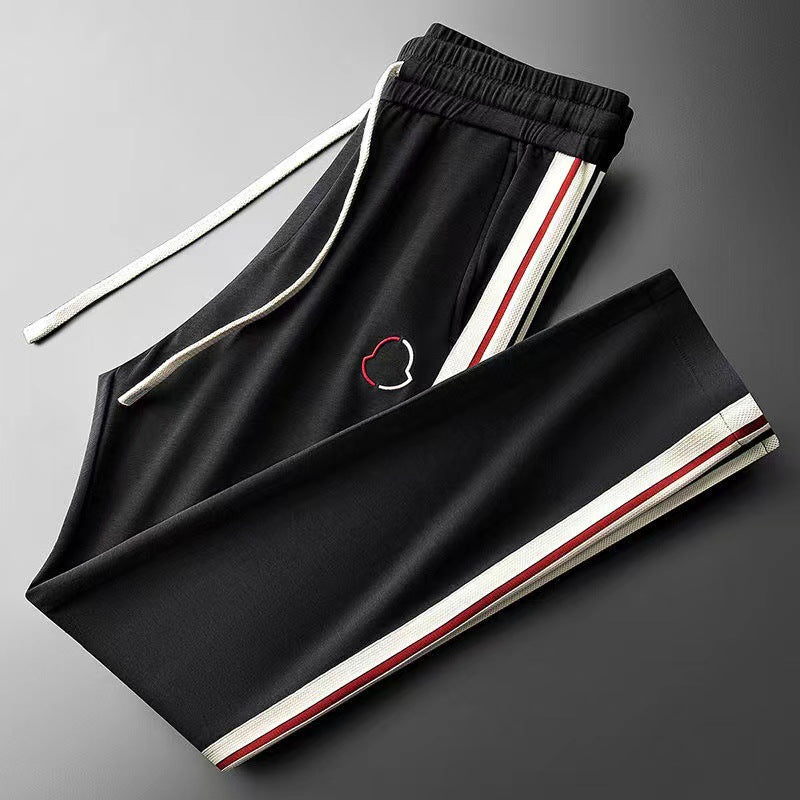 Front view of a men's premium quarter-zip tracksuit, ideal for sports and casual fashion.