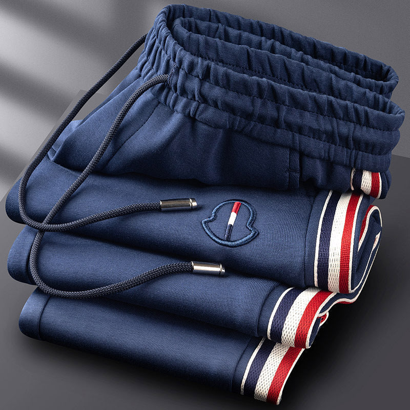 Complete men's quarter-zip tracksuit matching set. Premium athletic & lounge wear.