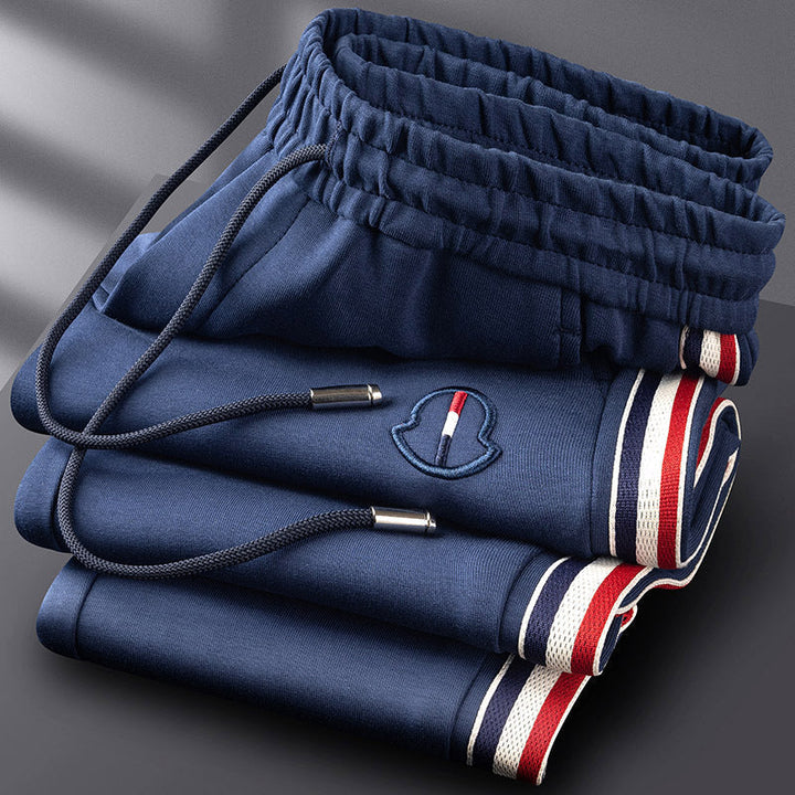 Complete men's quarter-zip tracksuit matching set. Premium athletic & lounge wear.
