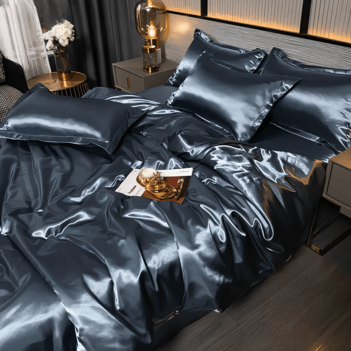 Neatly folded PURELISS polyester bedding set: soft duvet cover, sheet set, & pillowcases. Cozy & wrinkle-resistant.