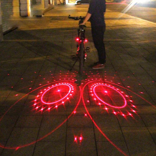 Bike safety LED taillight with laser beams for superior night visibility, essential cycling gear.