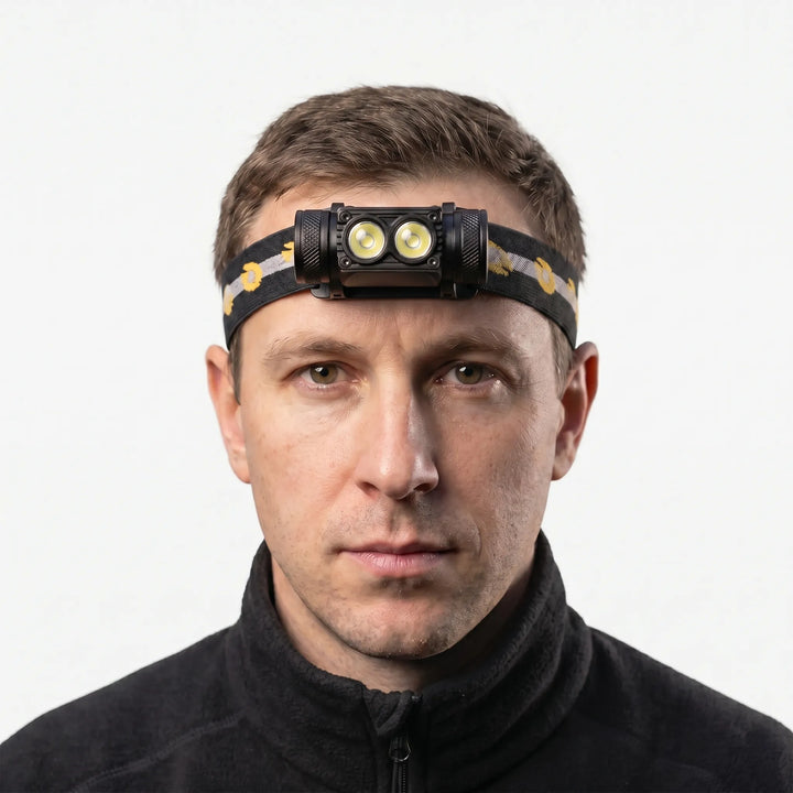 Unisex hands-free dual-LED rechargeable headlamp, ideal for camping, hiking, and night trail adventures.