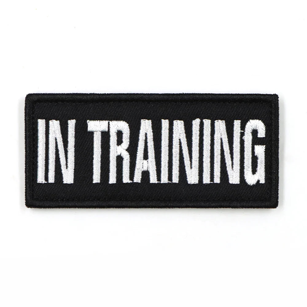 Stack of multiple 'SERVICE DOG' patches, ready for bulk purchase as K9 accessories or training aids