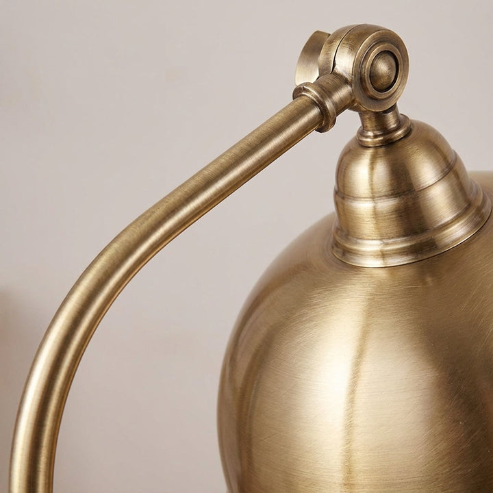 Stylish LED desk lamp, Brasselle, with a retro gold design, ideal for home office or bedroom accent.