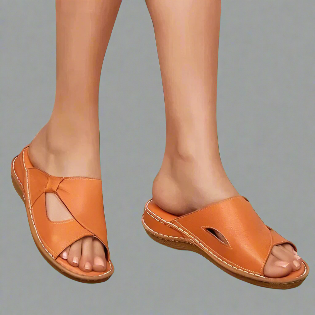 "Sandali ortopedici da donna in pelle rosa con design elegante, comfort superiore e dettagli raffinati."