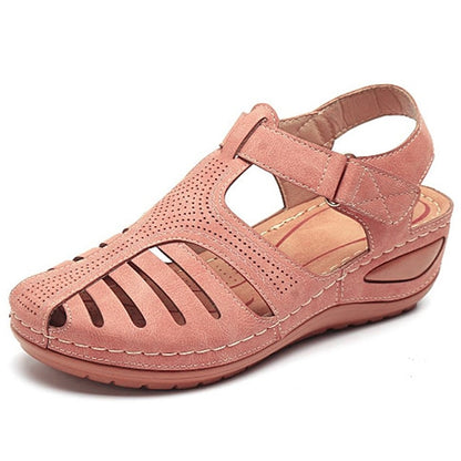 "Sandali ortopedici donna OrthoFlex eleganti in rosa, design ergonomico e soletta adattabile per comfort quotidiano."