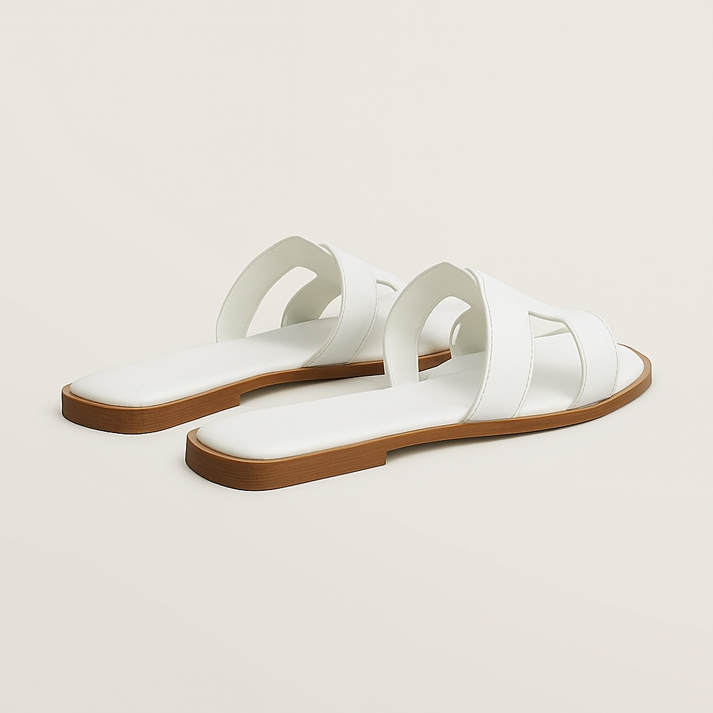 "Sandali piatti in pelle marrone donna con listini intagliati e regolabili, design elegante e traspirante estivo."