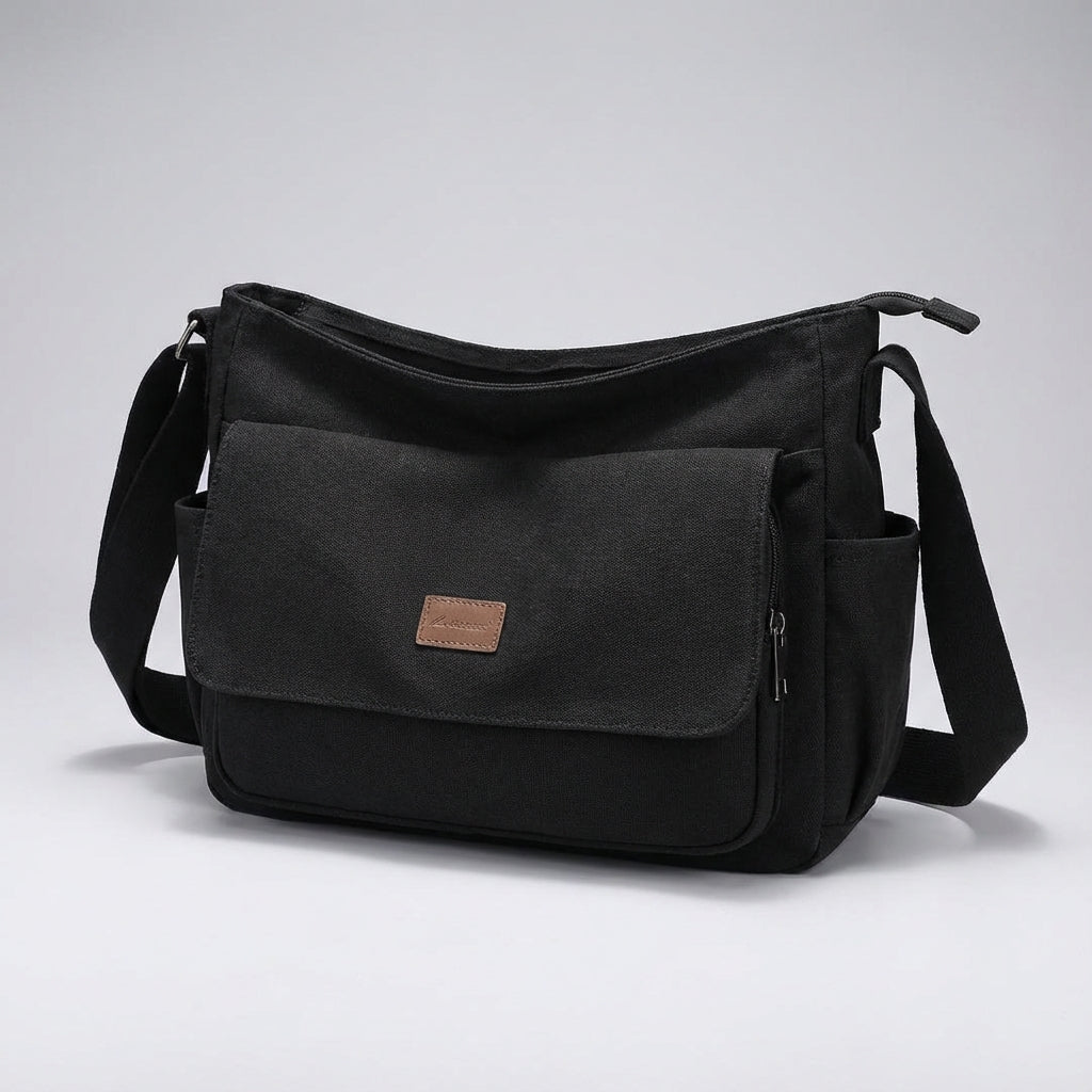 Open Satchelix unisex laptop messenger bag showing organized compartments for computer, tablet & essentials.