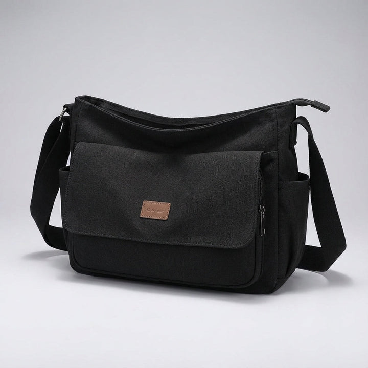 Open Satchelix unisex laptop messenger bag showing organized compartments for computer, tablet & essentials.