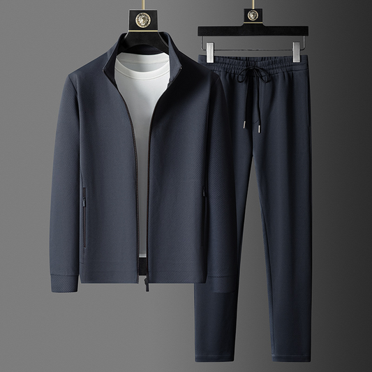 "Set da tuta uomo in Lycra nera, giacca con cerniera e pantaloni aderenti, ideale per sport e look casual."
