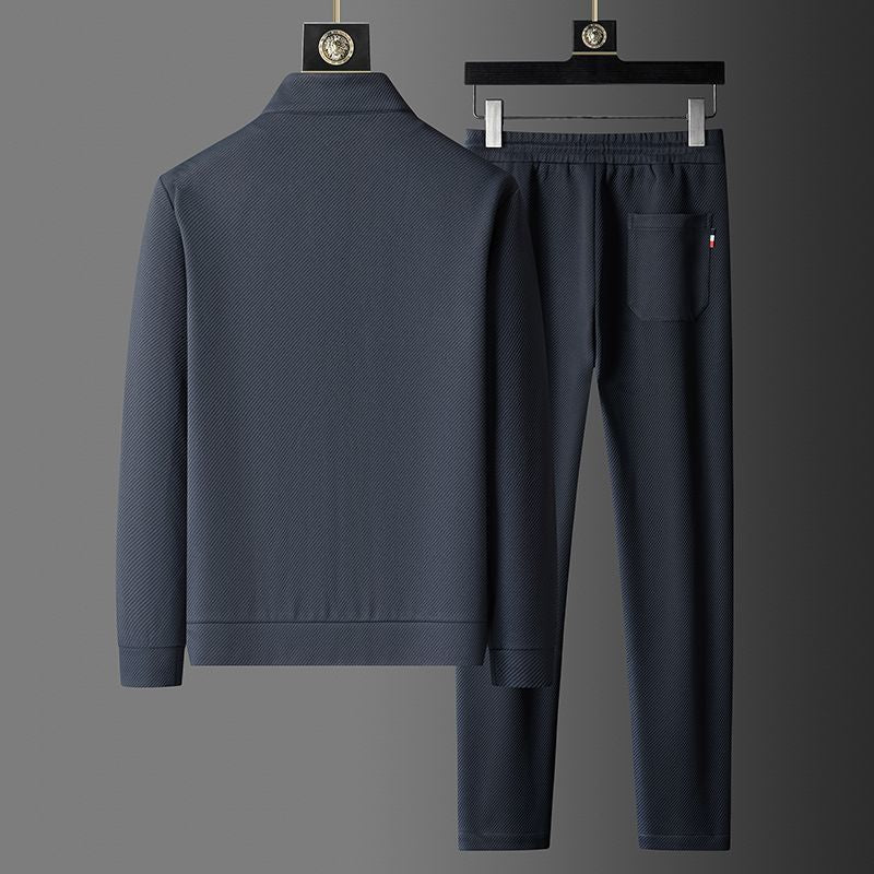 "Set da tuta uomo in Lycra nera, giacca con cerniera e pantaloni aderenti, ideale per sport e look casual."