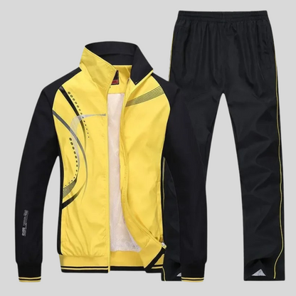 "Set sportivo uomo elegante, tessuto blu scuro, giacca con zip e pantaloni, design moderno, comfort elevato, vestibilità otti