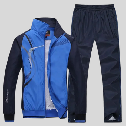 "Set sportivo uomo elegante, tessuto blu scuro, giacca con zip e pantaloni, design moderno, comfort elevato, vestibilità otti