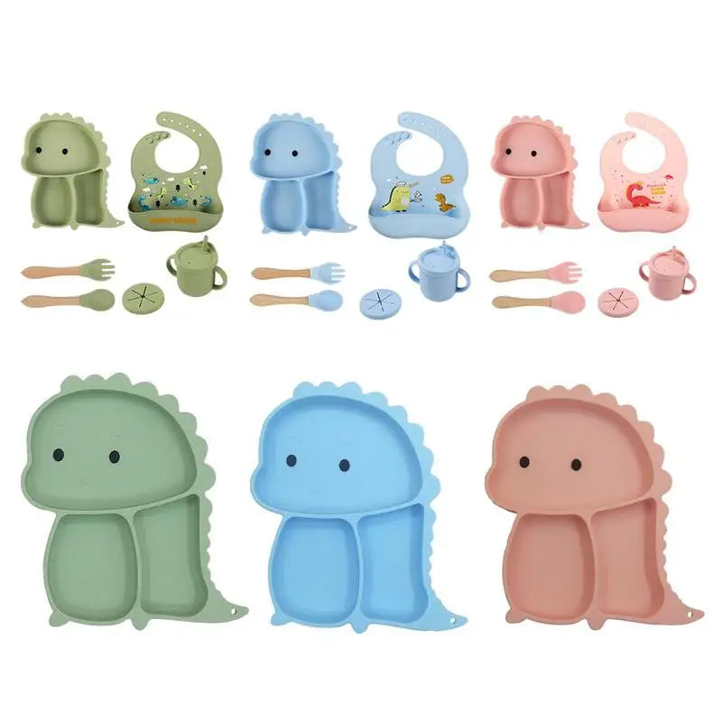 Set stoviglie silicone bambini, design dinosauro blu, antiscivolo, include piatto a ventosa, posate, bavaglino e bicchiere.