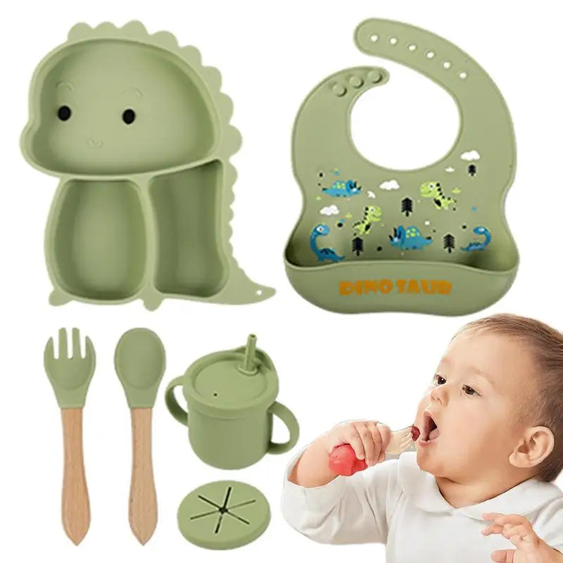 Set stoviglie silicone bambini, design dinosauro blu, antiscivolo, include piatto a ventosa, posate, bavaglino e bicchiere.