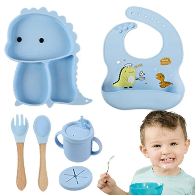 Set stoviglie silicone bambini, design dinosauro blu, antiscivolo, include piatto a ventosa, posate, bavaglino e bicchiere.