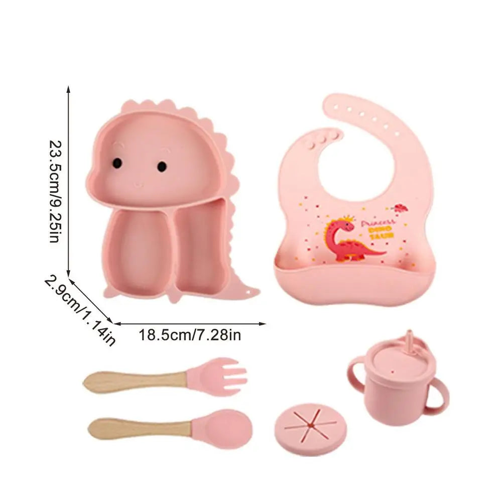 Set stoviglie silicone bambini, design dinosauro blu, antiscivolo, include piatto a ventosa, posate, bavaglino e bicchiere.