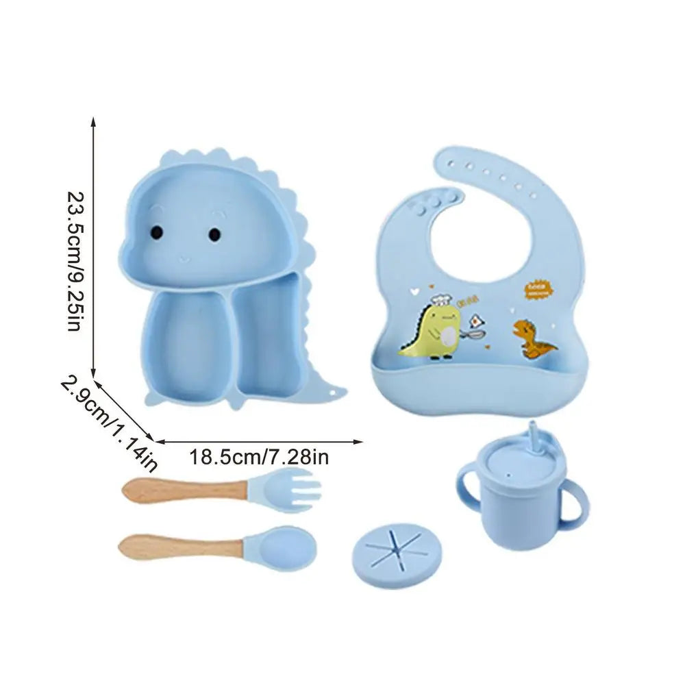 Set stoviglie silicone bambini, design dinosauro blu, antiscivolo, include piatto a ventosa, posate, bavaglino e bicchiere.