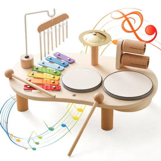 Set strumenti musicali in legno per bambini, include xilofono colorato e bacchette, ideale per stimolare la creatività.
