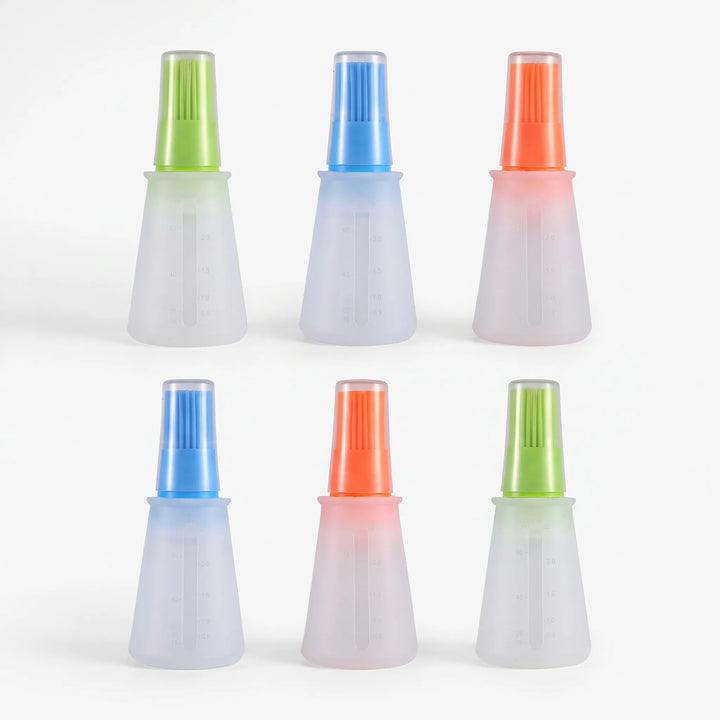 Versatile silicone oil dispensing brush for baking, grilling, roasting, and general kitchen cooking.