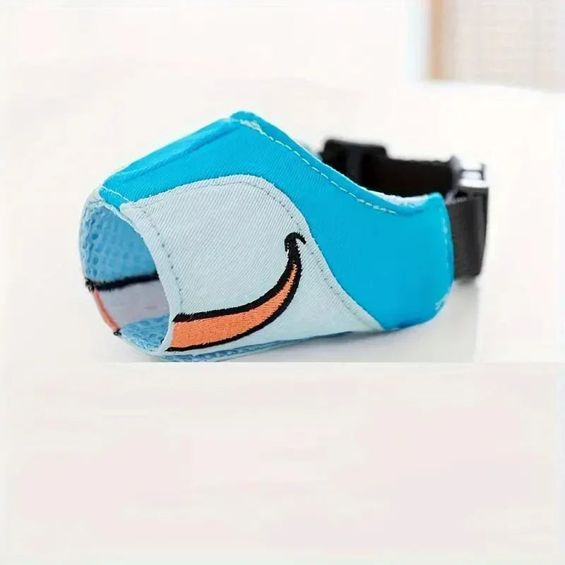 Sky blue cartoon dog muzzle, comfortable & breathable. Adjustable for medium to large dogs. Safe pet gear.
